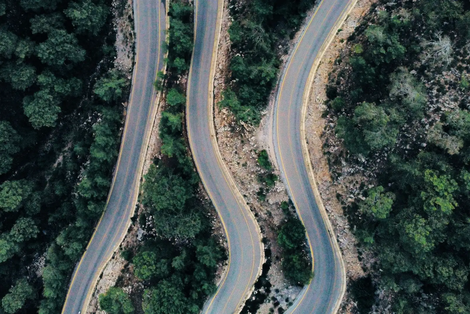Cinematic aerial video frame, mountain road
