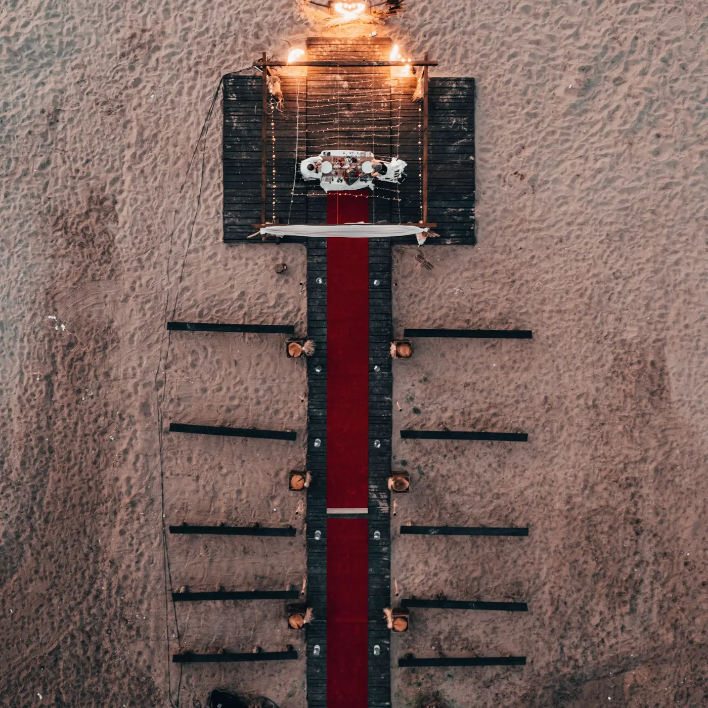 Ceremony from directly overhead, guests encircling the couple