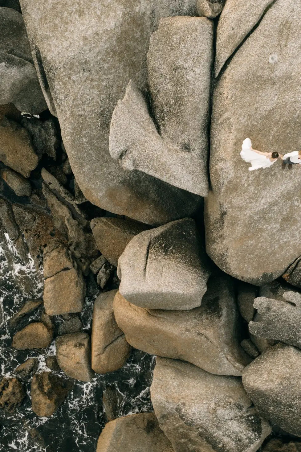 Couple portrait in a dramatic clifftop landscape